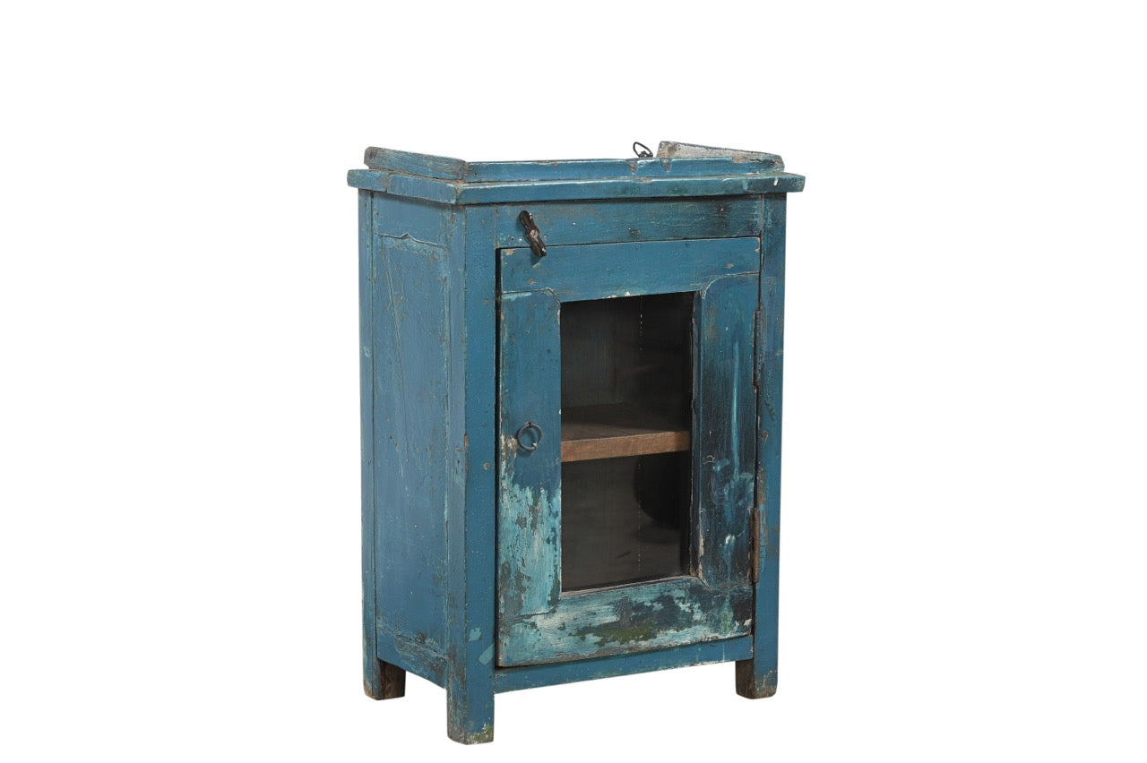 A vintage teak wood side cabinet with a blue painted exterior, iron hardware, and a glass front door.