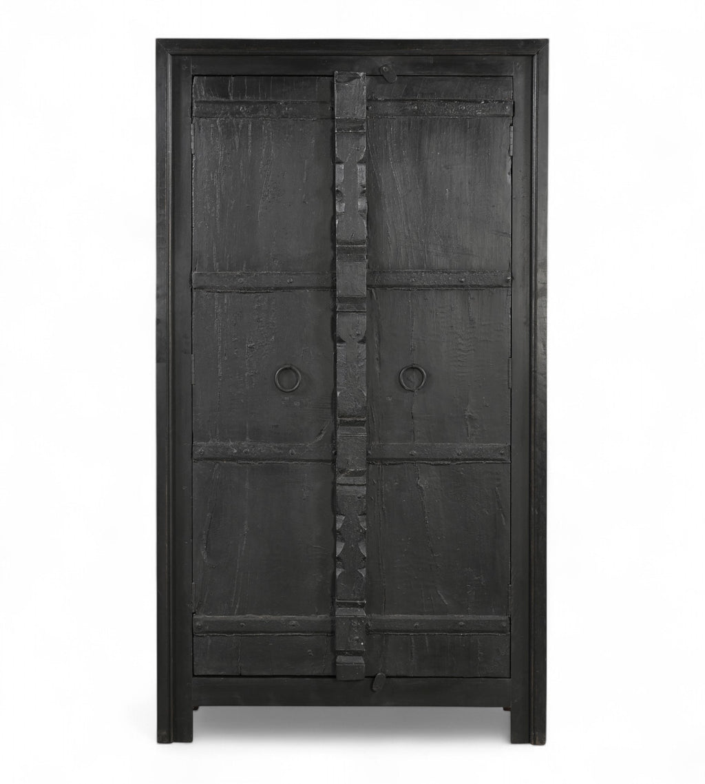 Vintage teak wood cabinet wardrobe with hand carved central spine and iron pull rings, in a black finish.