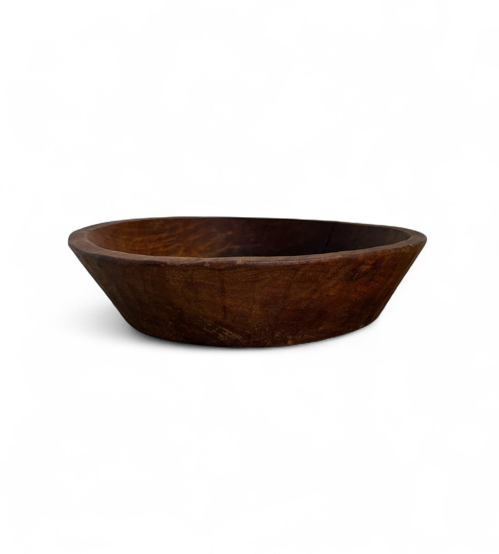 Wooden bowl on a white background