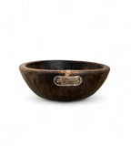 Wooden teak bowl with a metal handle on a white background