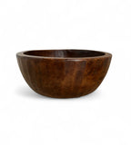 Deep wooden bowl on a white background