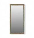 A tall rectangular vintage mirror with a wooden frame that has weathered finish in shades of green, blue, and earthy tones.
