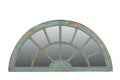 Arched mirror with a distressed turquoise frame on a white background