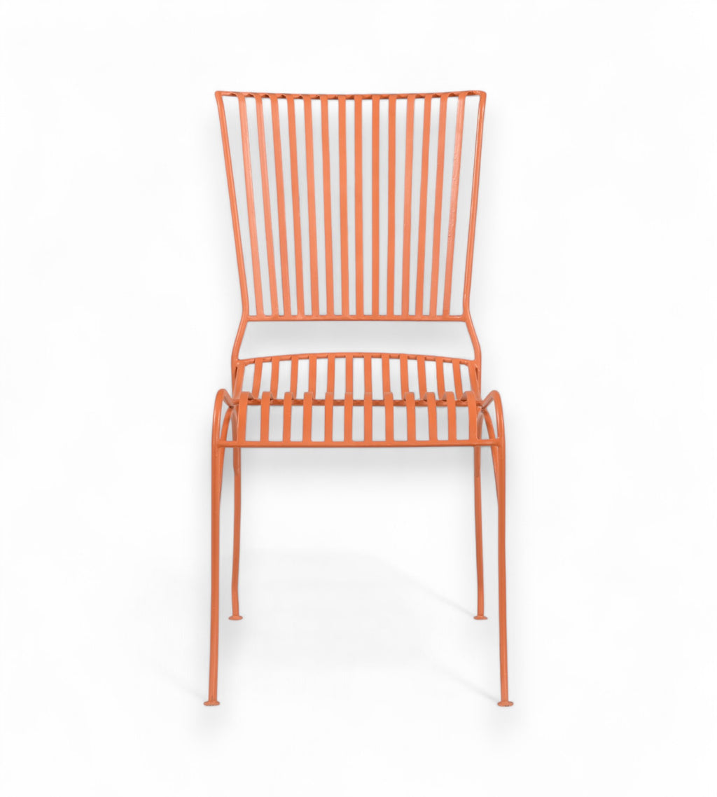 A terracotta orange iron chair with a grid backrest and seat, displayed against a white background.
