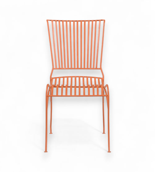 A terracotta orange iron chair with a grid backrest and seat, displayed against a white background.