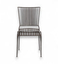 A dark finish iron chair with an open arched seat design and gently flared back, isolated on a white background.