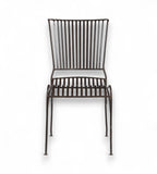 A dark finish iron chair with an open arched seat design and gently flared back, isolated on a white background.