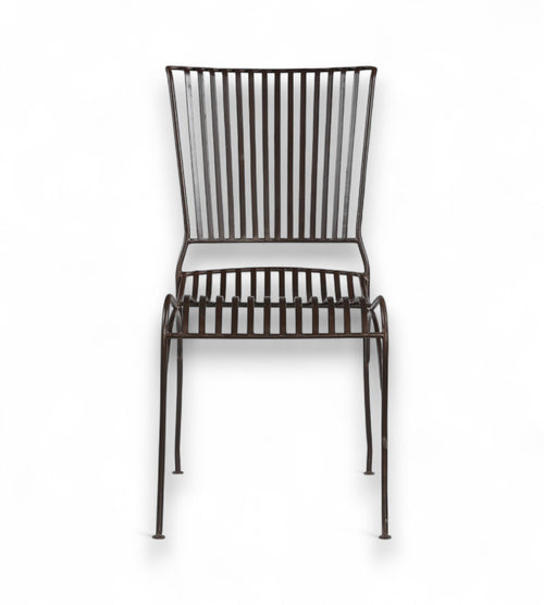 A dark finish iron chair with an open arched seat design and gently flared back, isolated on a white background.