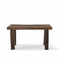 A vintage reclaimed wood bench with a rectangular seat and wooden legs.