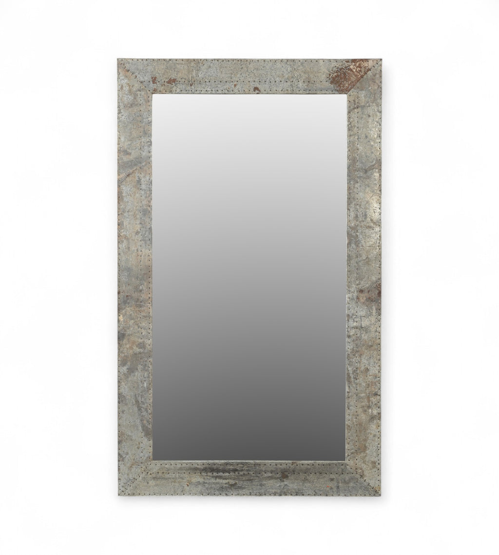A rectangular mirror with a frame made from reclaimed wood and raw iron, featuring a vintage design with rivet detailing.