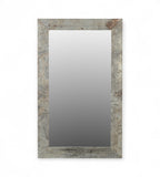 A rectangular mirror with a frame made from reclaimed wood and raw iron, featuring a vintage design with rivet detailing.