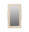 A rectangular vintage mirror with an uneven, textured teak wooden frame.