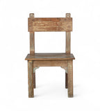 A wooden chair with a patina finish, featuring hints of green and yellow paint, with a simple backrest and seat design.