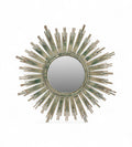 A round iron mirror frame with a sunburst design, featuring rays in green, yellow, and brown hues.