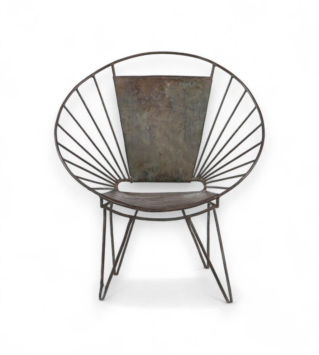 An iron chair with a fan back design and rounded profile, featuring slender legs and a cushioned seat.