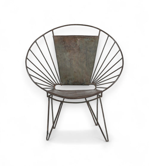 An iron chair with a fan back design and rounded profile, featuring slender legs and a cushioned seat.
