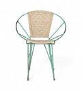 A vintage chair with a green iron frame and natural rope seat and backrest.