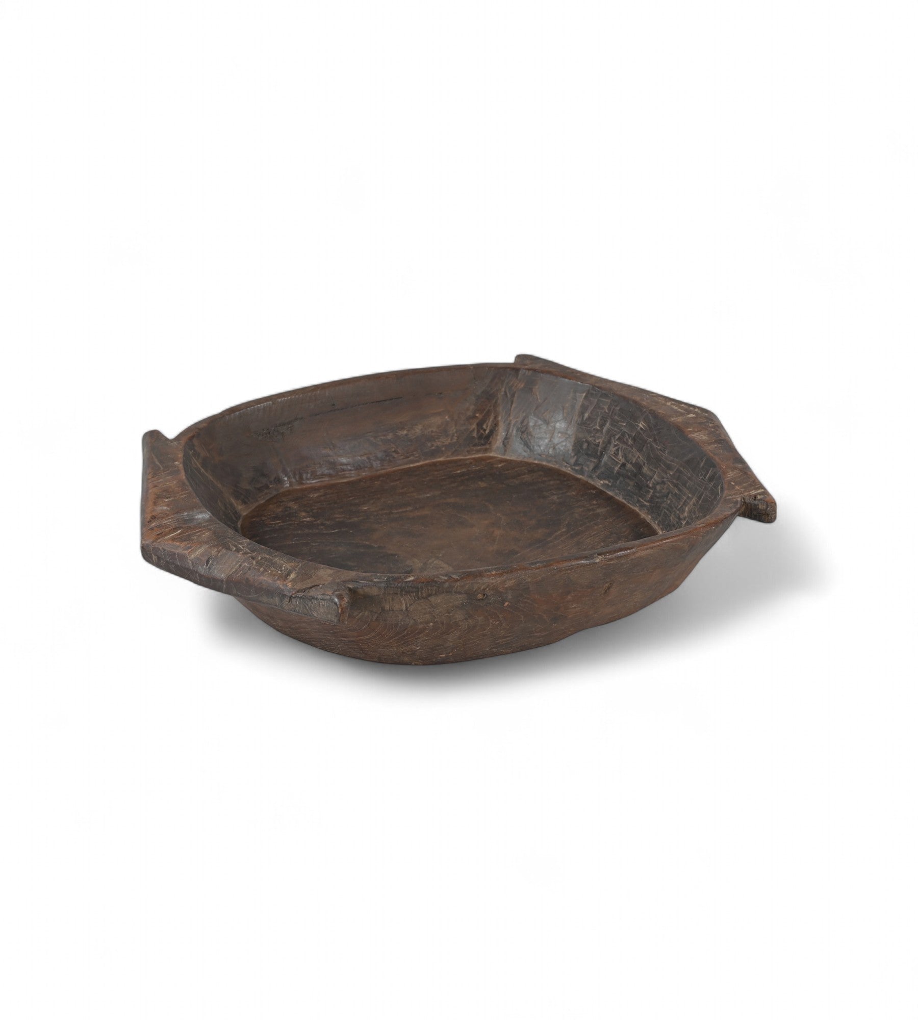 A vintage teak wood bowl with angular silhouette and carved handles, isolated on a white background.