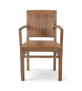 A vintage teak wood armchair with a squared off frame and angled armrests, showing wood grain and warm tones.