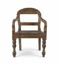 A vintage teak wood arm chair with a gracefully arched back, bowed armrests, and turned legs, with a worn finish and traces of green paint.