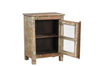 A vintage rustic teak wood side cabinet with a weathered frame, a glass door, and a metal pull ring.