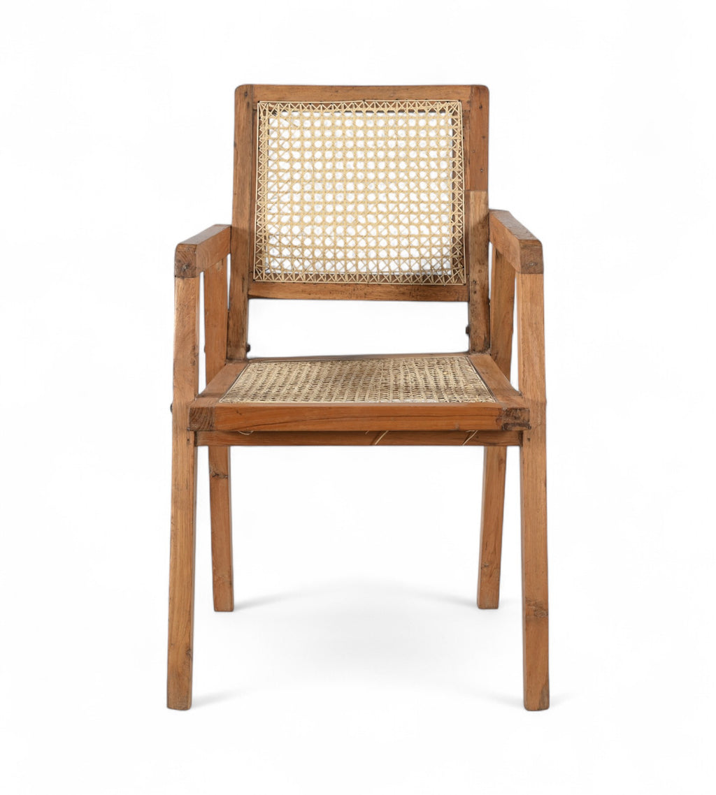 A vintage teak wood armchair with hand woven rattan seat and backrest, featuring angular legs and a clean design.