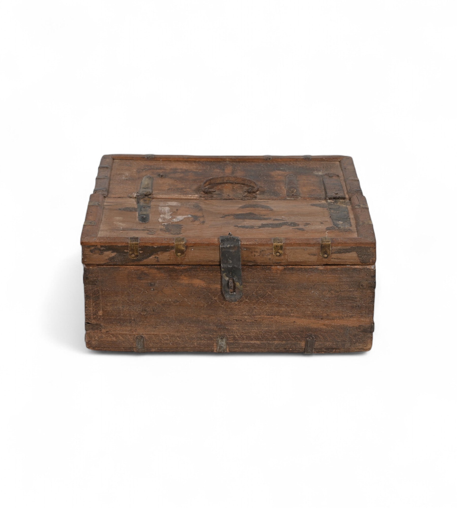 Vintage teak wooden box with metal accents, showing signs of aging and use,